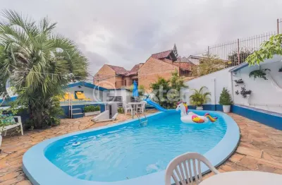 Casa com 4 quartos à venda na rua santo camaratta-santino, 6, parque santa fé, porto alegre, 176 m2 por r$ 742.000