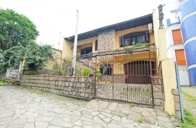 Casa com 3 quartos à venda na Rua Umbú, 137, Passo da Areia, Porto Alegre, 154 m2 por R$ 1.050.000