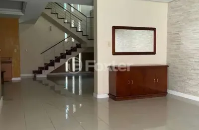 Casa com 4 quartos à venda na avenida fábio araújo santos, 1164, nonoai, porto alegre, 329 m2 por r$ 1.138.100