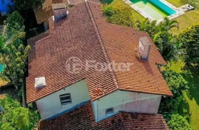 Casa em condomínio fechado com 5 quartos à venda na avenida firmino octávio bimbi, 255, cavalhada, porto alegre, 400 m2 por r$ 1.800.000