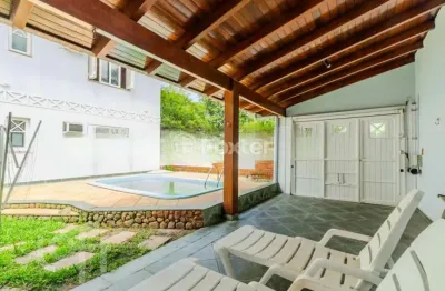 Casa em condomínio fechado com 5 quartos à venda na avenida juca batista, 1200, belém novo, porto alegre, 300 m2 por r$ 1.250.000