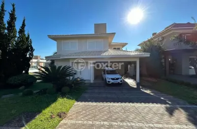 Casa em condomínio fechado com 3 quartos à venda na avenida senador salgado filho, 8500, querência, viamão, 459 m2 por r$ 1.690.000