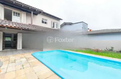 Casa com 4 quartos à venda na avenida guaíba, 13166, guarujá, porto alegre, 334 m2 por r$ 900.000