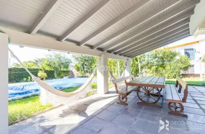 Casa em condomínio fechado com 3 quartos à venda na avenida firmino octávio bimbi, 255, cavalhada, porto alegre, 400 m2 por r$ 1.999.000