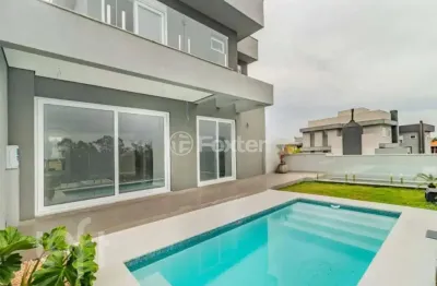 Casa em condomínio fechado com 3 quartos à venda na Rua Adolfo Inácio de Barcelos, 1490, Centro, Gravataí, 188 m2 por R$ 2.100.000