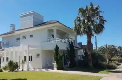 Casa em condomínio fechado com 6 quartos à venda na avenida central, 161, zona nova, capão da canoa, 354 m2 por r$ 3.550.000