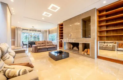 Casa em condomínio fechado com 4 quartos à venda na avenida juca batista, 8000, chapéu do sol, porto alegre, 590 m2 por r$ 5.000.000