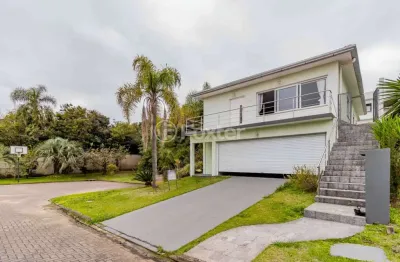 Casa em condomínio fechado com 4 quartos à venda na avenida senador salgado filho, 8500, querência, viamão, 330 m2 por r$ 990.000