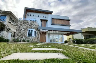 Casa em condomínio fechado com 4 quartos à venda na rua onório germano, 195, centro, capão da canoa, 247 m2 por r$ 2.490.000