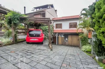 Casa em condomínio fechado com 3 quartos à venda na rua erechim, 100, nonoai, porto alegre, 202 m2 por r$ 860.000