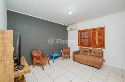 Casa com 3 quartos à venda na rua ida passuelo, 3, vila nova, porto alegre, 94 m2 por r$ 585.000