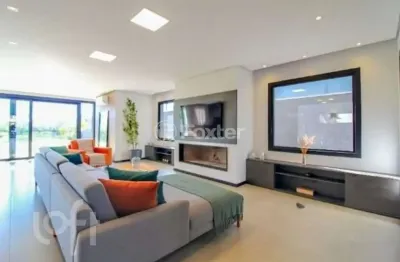 Casa em condomínio fechado com 4 quartos à venda na avenida juca batista, 9000, belém novo, porto alegre, 450 m2 por r$ 3.550.000