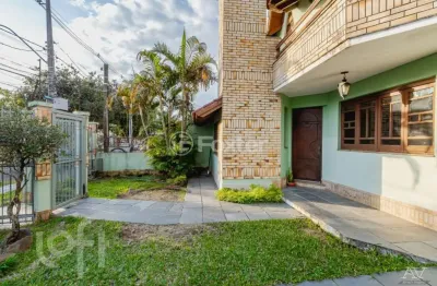 Casa com 4 quartos à venda na avenida delmar rocha barbosa, 413, parque santa fé, porto alegre, 253 m2 por r$ 1.050.000