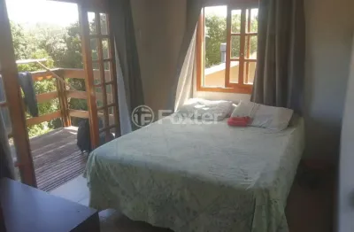 Casa em condomínio fechado com 3 quartos à venda na Rua Jacarandá, 252, Santo Onofre, Viamão, 258 m2 por R$ 850.000