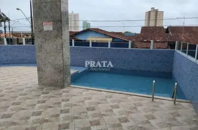 Caiçara praia grande 2 dormitorios 1 suíte prédio com lazer