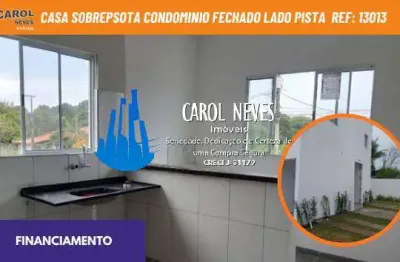 Casa sobreposta condominio fechado lado pista financiamento itanhaem