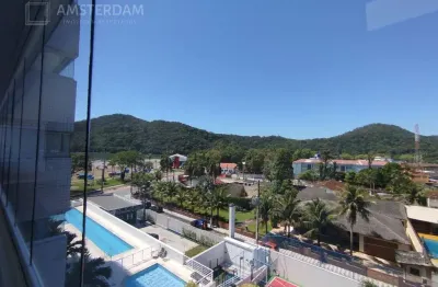 Prédio frente ao mar no centro de bertioga com 2 dormitórios, 1 suíte, 2 vagas de garagem cobertas, varanda gourmet envidraçada