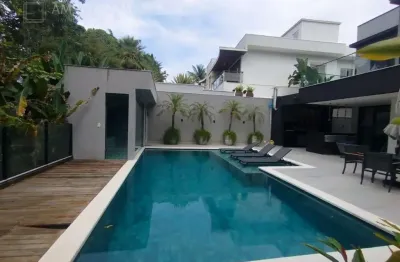 Casa nova à venda no M20 na Riviera, 6 suítes, 4 vagas, piscina, varanda gourmet integrada, 467,00 m² de puro luxo.