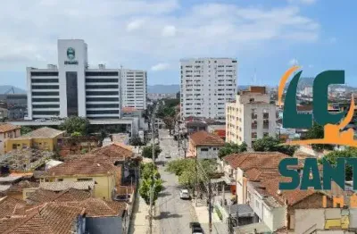 Apartamento de 2 dormitórios sendo 1 suíte com varanda e vaga de garagem .