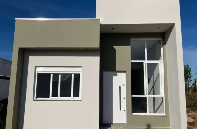 Casa 02 dorm à venda no bairro capão novo - 2 vagas de garagem