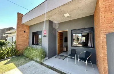 Casa geminada 2 dorm à venda no bairro capão novo com 73 m² de área privativa - 1 vaga de garagem