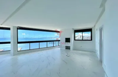 Pé na areia em itapema com 4 suites, living integrado, churrasqueira, 3 vagas ,vista mar