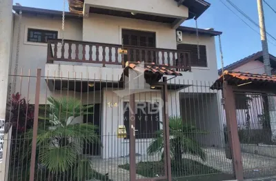 Casa com 3 quartos à venda na rua juvenil pereira fraga, 104, cavalhada, porto alegre por r$ 900.000