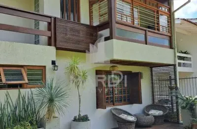 Casa com 4 quartos à venda na rua olécio cavedini, 235, ipanema, porto alegre por r$ 789.000