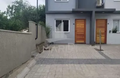 Casa em condomínio fechado com 2 quartos para alugar na rua miguel ascoleze, 125, vila nova, porto alegre por r$ 2.400