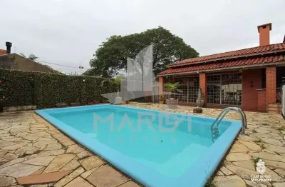 Casa com 3 quartos à venda na avenida guarujá, 70, guarujá, porto alegre por r$ 599.000