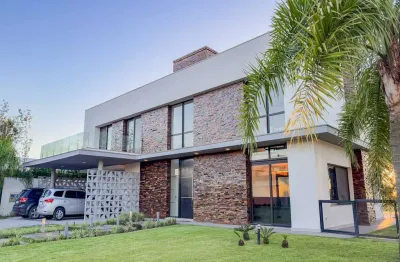 Casa em condomínio fechado com 5 quartos à venda na avenida juca batista, 8000, belém novo, porto alegre por r$ 4.950.000