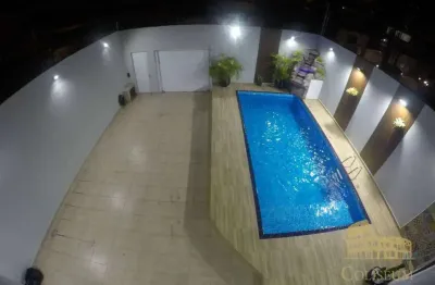Casa com 3 dormitórios à venda, 360 m² por R$ 1.800.000,00 - Vila Assunção - Praia Grande/SP