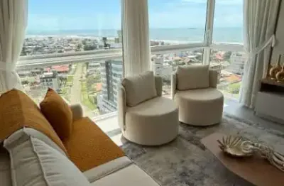 Apartamento mobiliado e decorado com vista para o mar em tramandaí