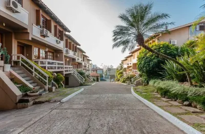 Casa em condomínio fechado com 2 quartos à venda na rua general rondon, 1259, tristeza, porto alegre por r$ 1.080.000