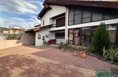 Casa com 3 quartos à venda na rua jacipuia, 295, guarujá, porto alegre por r$ 970.000