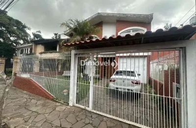 Casa com 4 quartos à venda na rua vicente failace, 466, tristeza, porto alegre por r$ 890.000