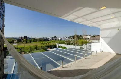 Casa em condomínio fechado com 4 quartos à venda na avenida juca batista, 8000, belém novo, porto alegre por r$ 4.900.000