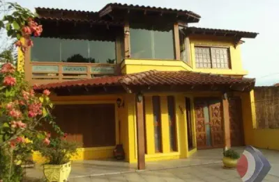 Casa com 4 quartos à venda na rua marquês do maricá, 550, vila nova, porto alegre por r$ 856.000