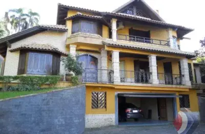 Casa com 4 quartos à venda na avenida coronel marcos, 96, vila conceição, porto alegre por r$ 1.900.000