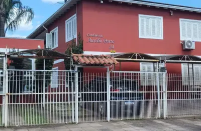 Casa em condomínio fechado com 2 quartos à venda na rua aurélio porto, 24, três portos, esteio por r$ 195.000