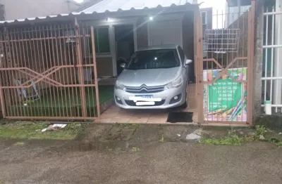 Casa com 4 quartos à venda na paulo barbieri de moura, 262, fortuna, sapucaia do sul por r$ 310.000