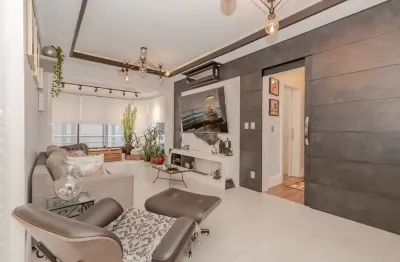 Amplo e elegante apartamento de 2 dormitórios, com 111m² privativos, no coração do menino deus.