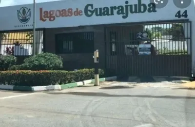 Terreno em condomínio fechado à venda na rua eixo lagoa, guarajuba, camaçari por r$ 255.000