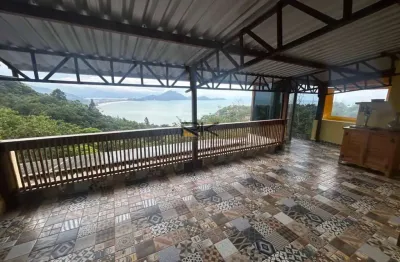 Casa em condominio com 5 dormitórios,4 vagas de garagem,varanda gourmet com churrasqueira e piscina com vista para o mar