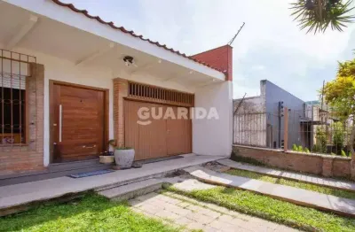 Casa residencial com 3 dormitórios e 2 vagas de garagem no bairro jardim botânico