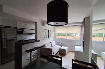 Apartamento mobiliado com 2 dormitórios e 1 vaga de garagem no bairro Vila Nova - Porto Alegre/RS