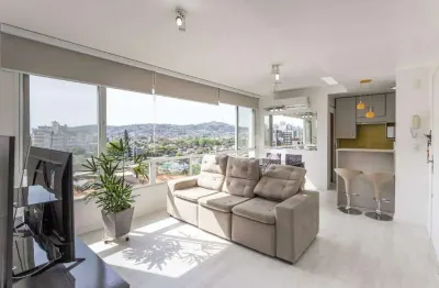 Apartamento mobiliado com 2 dormitórios, sendo 1 suíte, e 2 vagas de garagem no bairro jardim botânico