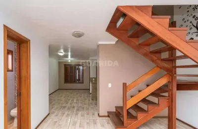 Casa residencial com 3 dormitórios, sendo 2 suítes e 3 vagas de garagem no bairro cavalhada