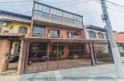 Casa residencial ou comercial com diferenciais para ambas funcionalidades, no Bairro Partenon.