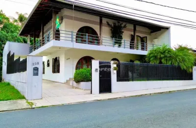 Belíssima casa com 4 dormitórios sendo 1 suítes, 7 salas, área de festas e piscina, no bairro itoupava norte em blumenau!